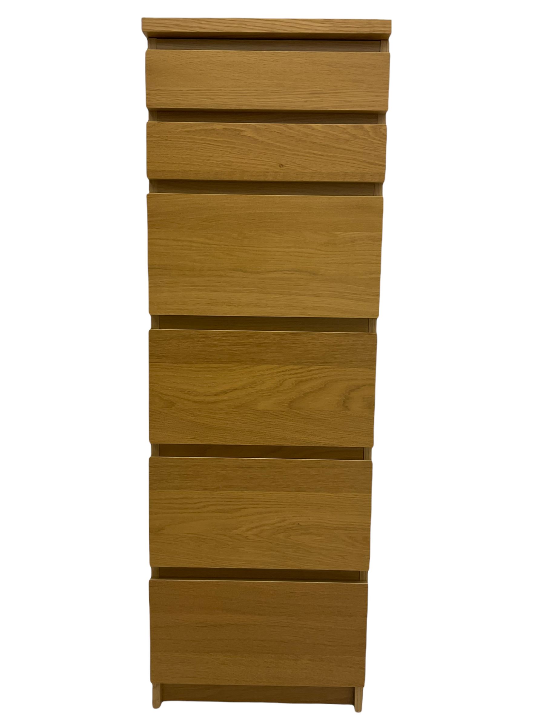 IKEA light oak finish chest, fitted with hinged vanity top, above six graduating drawers 