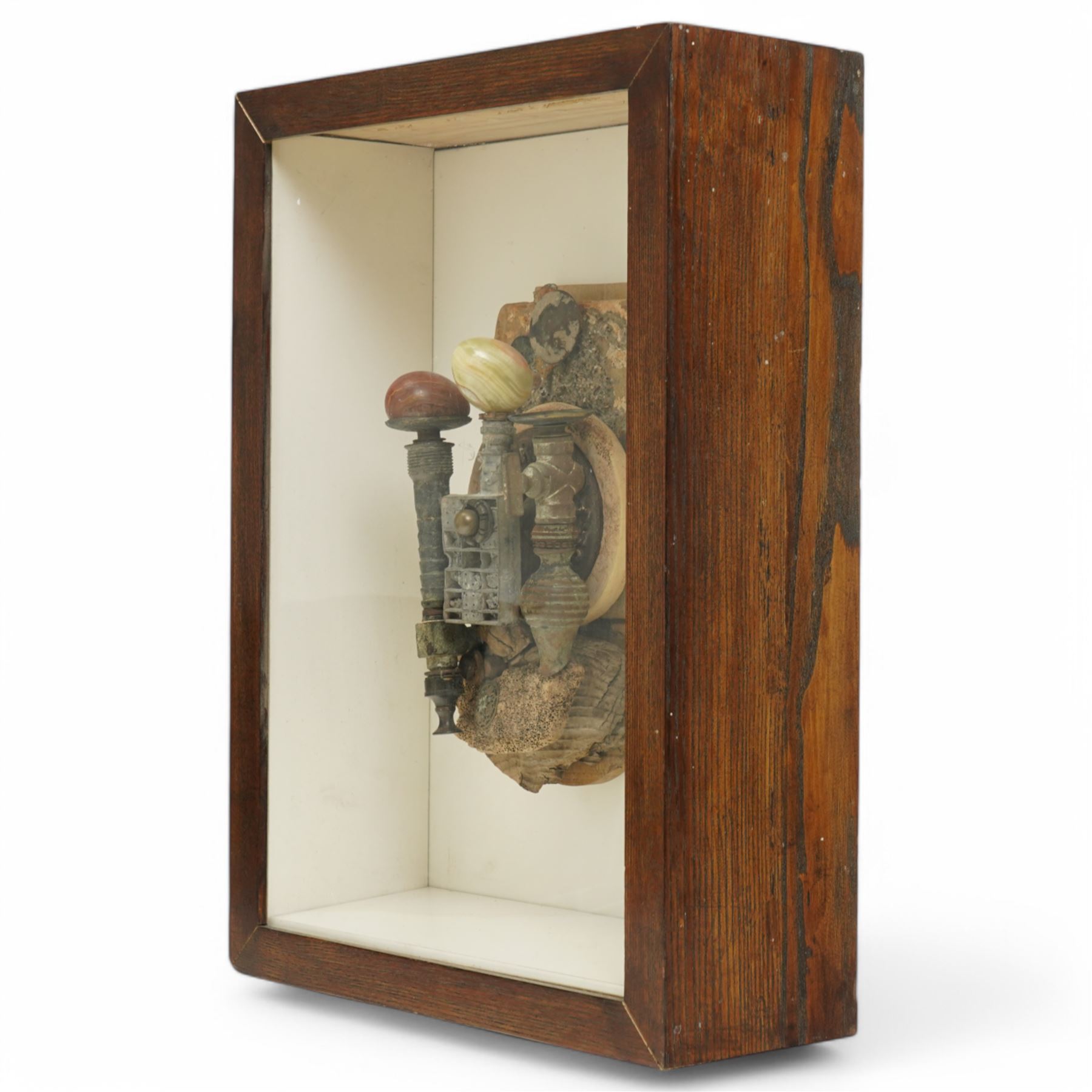 Andrew Coates (British 1939-): 'The Guardians', assemblage in wood, found objects and with three marble eggs, titled and dated 1999 verso, in case, overall 50cm x 37cm