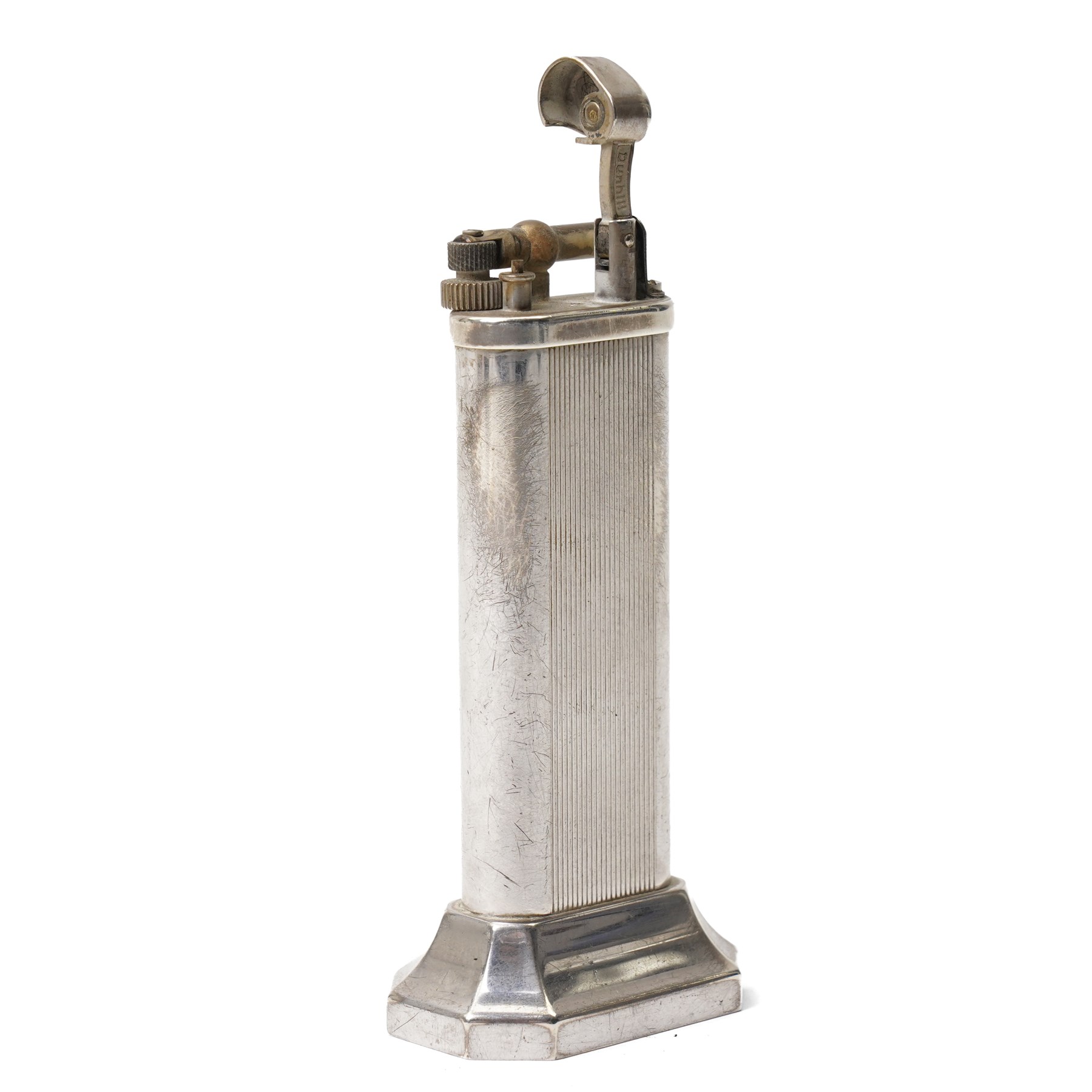Dunhill - tallboy table lighter, silver-plate with reeded decoration and engine-turned body, on octagonal stepped base H10cm 