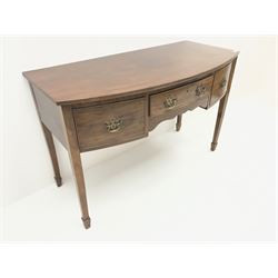19th century mahogany bow front side table/desk, three graduating drawers, square tapering supports on spade feet