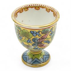 19th century porcelain campana form pot pourri vase, with associated cover, probably Derby, 18th century Worcester scale blue ground kakiemon coffee cup and saucer, c1770, Copeland and Garrett cylindrical vase with flared rim and four scroll supports, H12cm, porcelain chamber stick, modelled as a leaf with grapes flanking the ring handle and a Chinese Export egg cup 