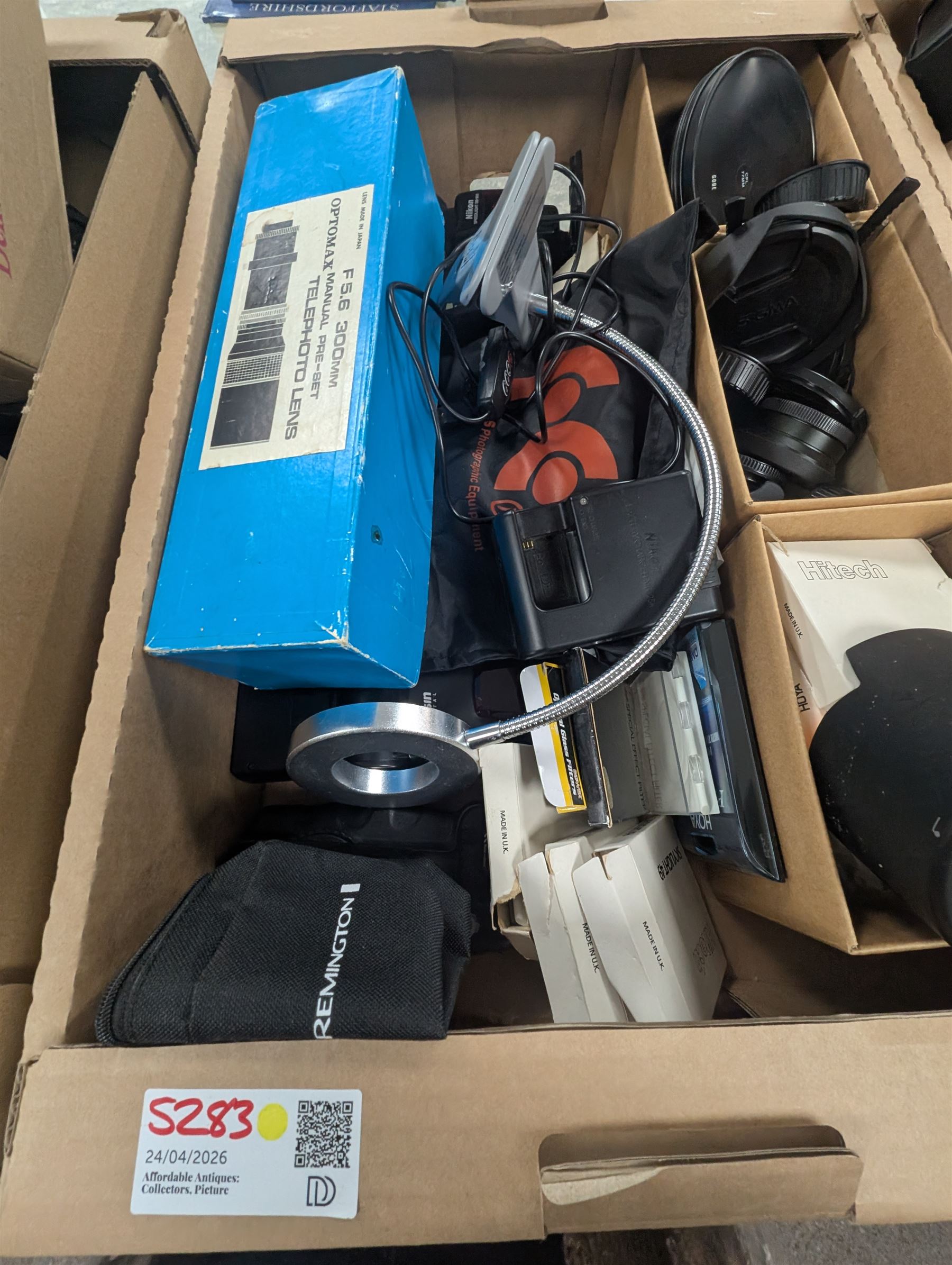 Collection of photography equipment, including flashes, hoods, filters, telephoto lens, bags, etc