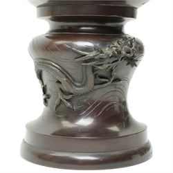 Japanese late Meiji period bronze koro and cover, surmounted by an eagle finial and with bird decoration in high relief to each side, twin elephant trunk handles, bearing indistinct character signature to one side, H82cm