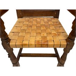Mouseman - circa. 1930s set of six (4+2) oak dining chairs, panelled back carved with the Bagshawe family crest, the moto 'Forma Flos Fama Flatus' over an arm grasping a bugle-horn with ribbon tie and Yorkshire rose motif, adzed frame, leather lattice strap seat, on octagonal supports united by stretchers, two carvers and four side chairs, each carved with mouse signature, by Robert Thompson of Kilburn 

Provenance: Owned since manufacture by the Bagshawe family, descendants of the Staithes Group Artist Joseph Richard Bagshawe RBA (1870-1909).