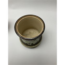 A group of Doulton Lambeth and Royal Doulton tobacco jars, to include examples with relief moulded foliate decoration, each with impressed marks and markers monograms beneath. 