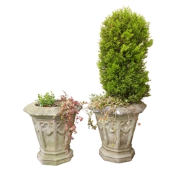  Pair of large composite stone octagonal garden planters, with Gothic panel tapering sides on stepped bases, D61cm, H60cm (2)  