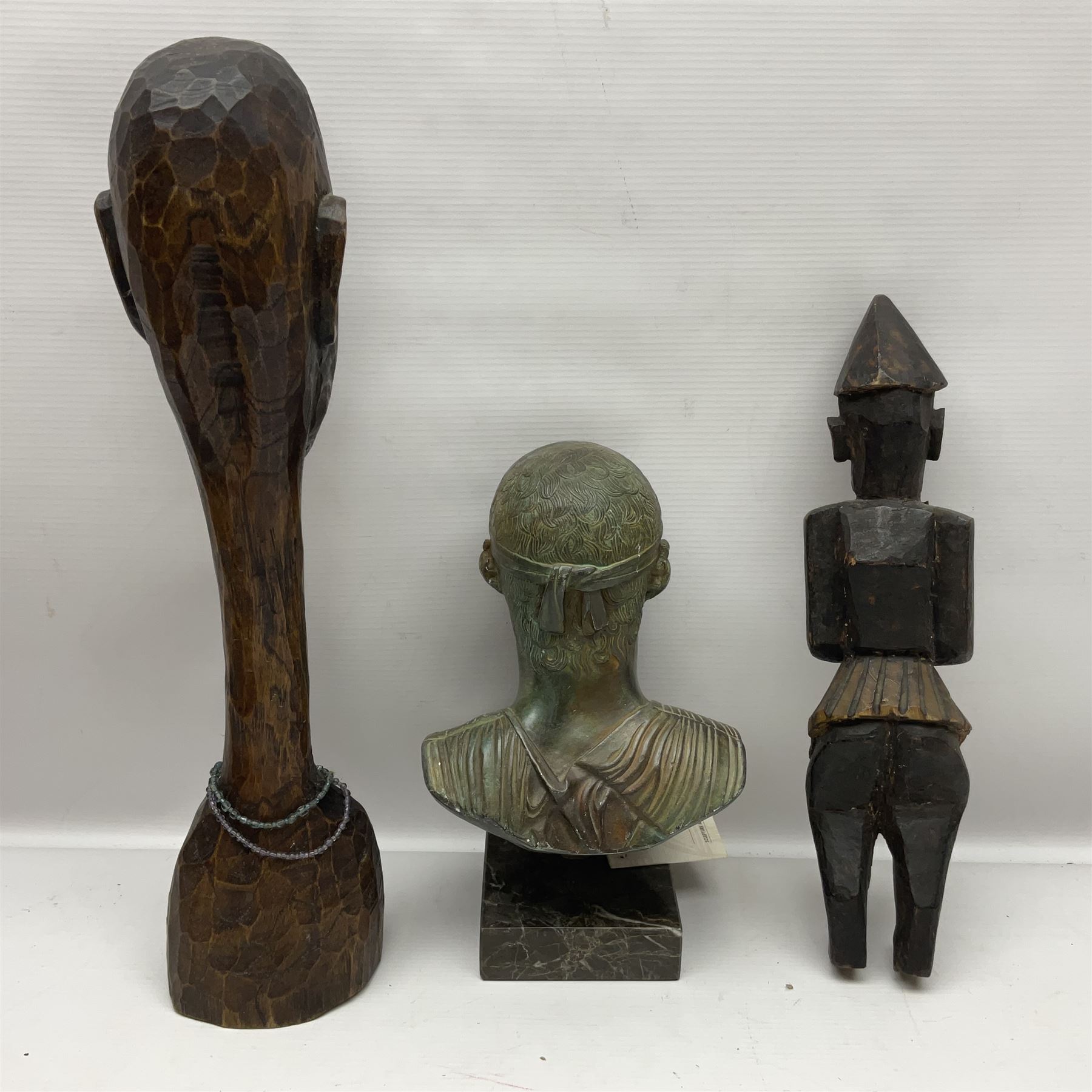 Bronzed bust of Greek man upon a marble base, together with two wooden sculptures 