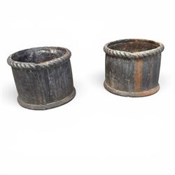 Pair of 19th century lead garden planters of cylindrical form, the rolled rope twist rims over a plain body decorated with applied flowerhead roundels, in antique weathered finish