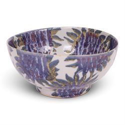 Sophie Hamilton (1963- ); Sunflower bowl, decorated with blue and purple sunflowers on a pale blue ground, with makers mark beneath, D23cm 