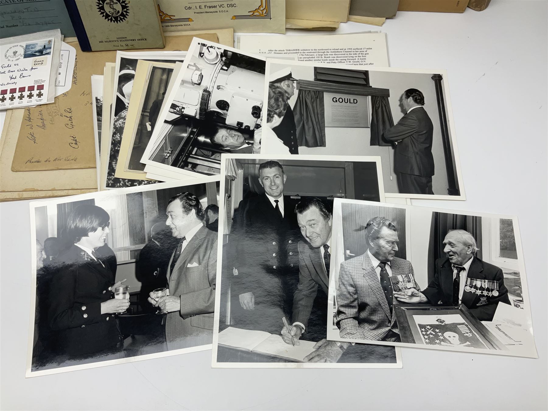 WW2 submarine interest - archive of ephemera and photographs relating to submariner Petty Officer (later Lieutenant) Thomas William Gould V.C. of HMSub Thrasher; predominantly post-war with later copies of contemporary photographs and documents including Certificate of Service in slip-case, War Patrol Reports, First Day Covers, press cuttings, 'For Valour' film script, business cards etc.
Auctioneer's Note: An extract from Gould's VC award citation reads 