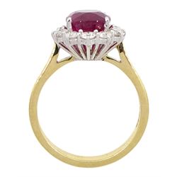 18ct gold oval cut ruby and round brilliant cut diamond cluster ring, hallmarked, ruby approx 3.40 carat, total diamond weight approx 0.65 carat