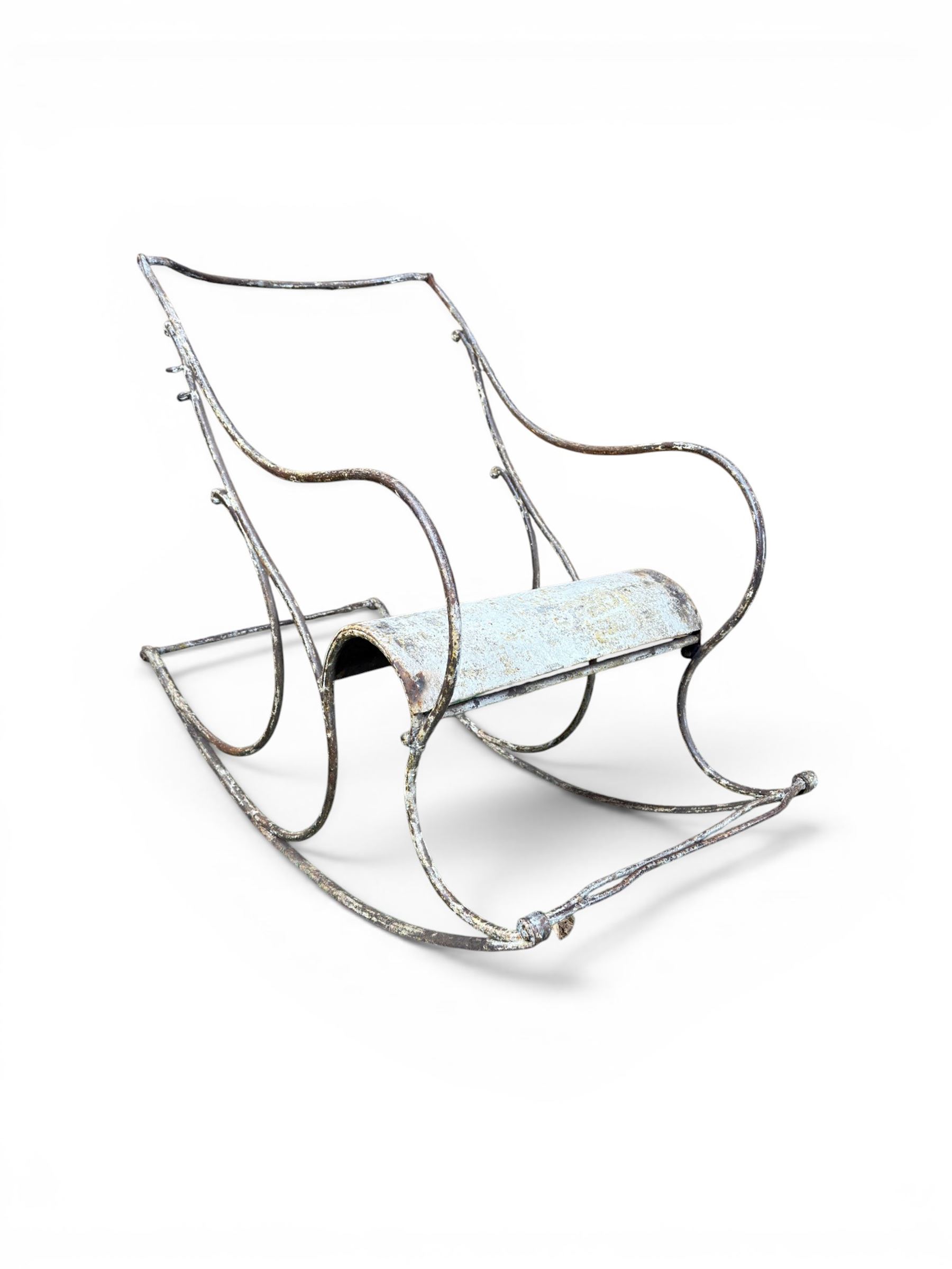 Pair of large unusual 19th century wrought iron garden rocking chairs, simple scroll design, lacking canvas seat