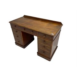 Victorian mahogany twin pedestal desk, rectangular top with raised back, fitted with nine drawers on plinth bases