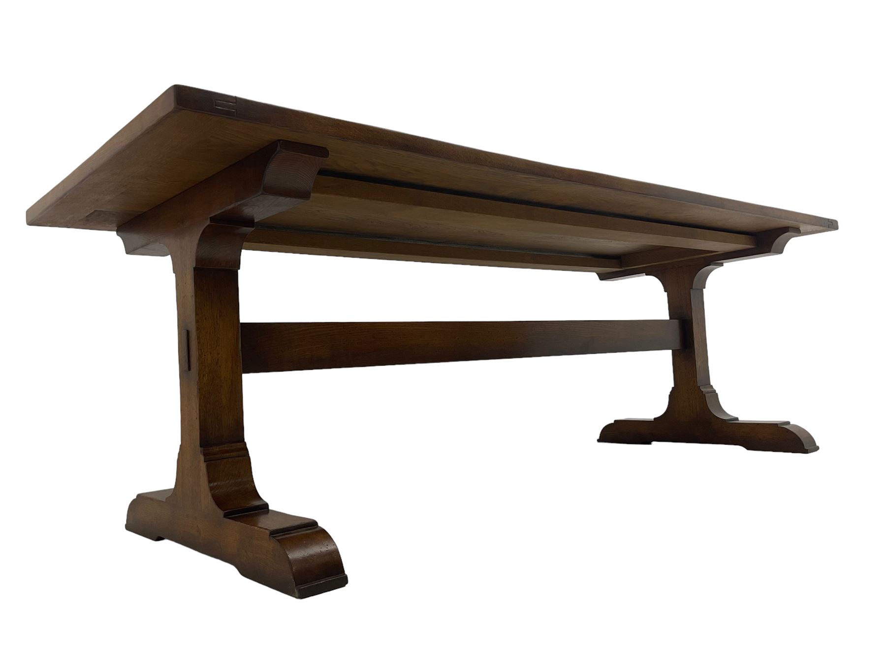 Dorset Oak - large refectory dining table, rectangular plank top, raised on shaped end supports with sledge feet, united by stretcher