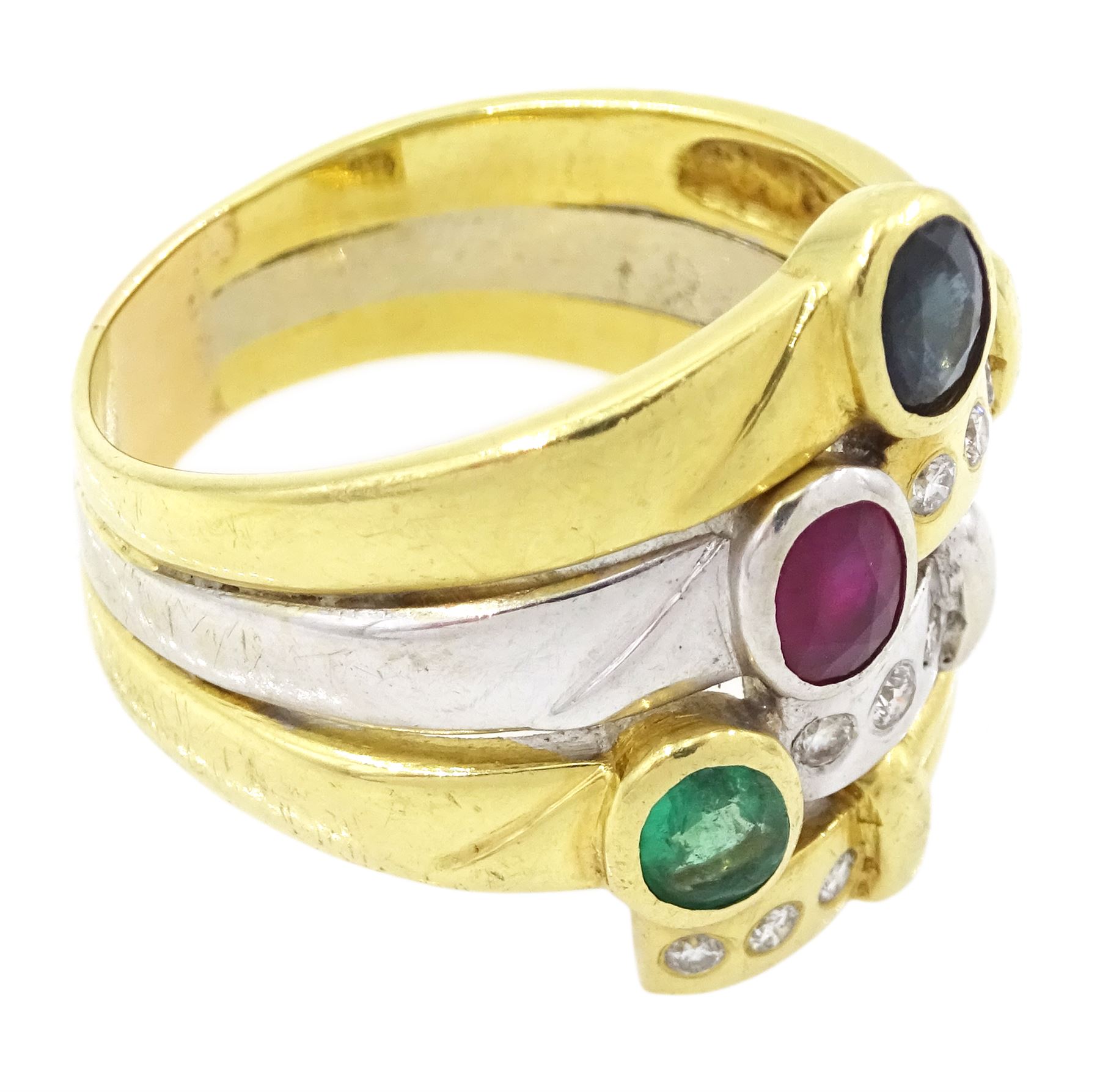 18ct gold multi gemstone set ring, four white and yellow gold rows set with an oval cut sapphire, ruby and emerald and round brilliant cut diamonds