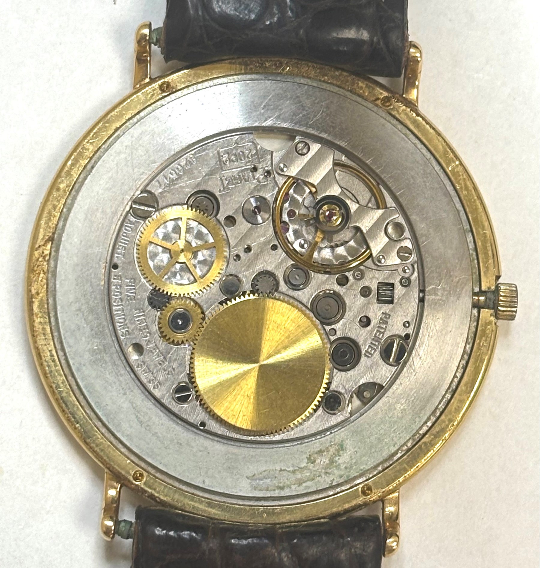Piaget Altiplano ultra thin 18ct gold diamond set manual wind wristwatch, Ref. 2642, Cal. 20P2, silvered dial with baton hour markers, the gold outer ring set with eight round brilliant cut diamonds, on brown leather strap with Piaget 18ct gold buckle and 18ct gold diamond set spacer