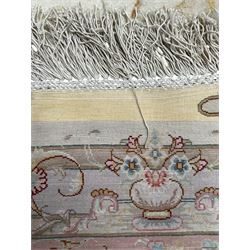 Persian Mahal densely knotted ivory ground carpet, floral rosette medallion surrounded by interlacing leafy branches and palmettes, scrolling border decorated with foliate motifs, within guard stripes, with signature panels to each end