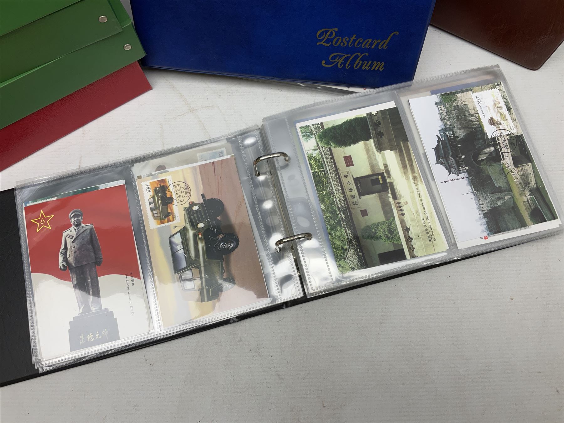 Mostly Chinese stamps including  covers and postcards, many being from the 80s and 90s, housed in ten folders