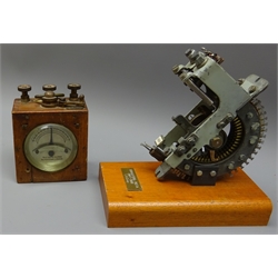  Mahogany cased Galvanometer, silvered dial inscribed Telegraph Works, Silvertown, London, wih brass fittings, H12cm, and a section of a Telephone number selector, No.20201, on mahogany plinth, labelled 'Bradford Rota 1947-1988 E A Gray', H17.5cm (2)    