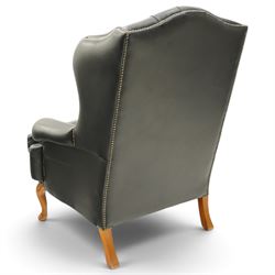 Pair of quality Georgian design wingback club armchairs, the high arched back with wings over rolled arms, upholstered in back-buttoned black leather with loose seat cushion, raised on foliate carved cabriole supports