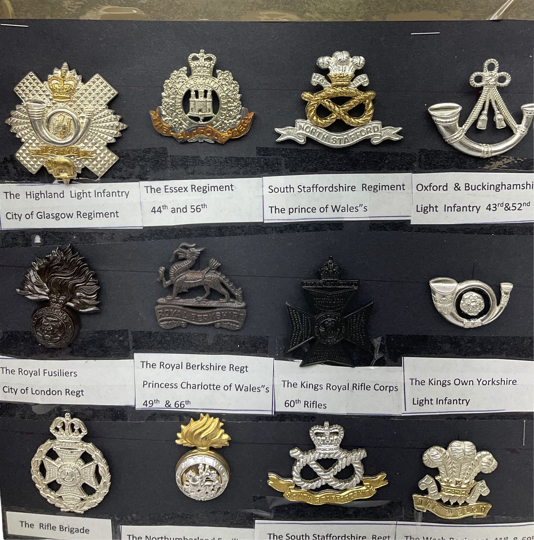Collection of thirty-two reproduction military badges, including Royal Scots Fusiliers, Royal Lincolnshire Regiment, The Boarders Regiment etc. 