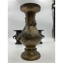 Chinese bronze vase, of baluster form with elongated neck, decorated in relief with birds amongst prunus blossom, together with a smaller pair of twin handled bronzed vases, decorated with peacocks and a blue Peking glass dish, with white metal mounted decorated with dragons, bronze vase H23.3cm