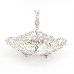Edwardian silver swing handled basket, of oval form with shaped rim, embossed with floral ...