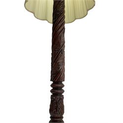 20th century mahogany standard lamp, the rope twist column turned and carved with acanthus leaves, on circular base, with shade