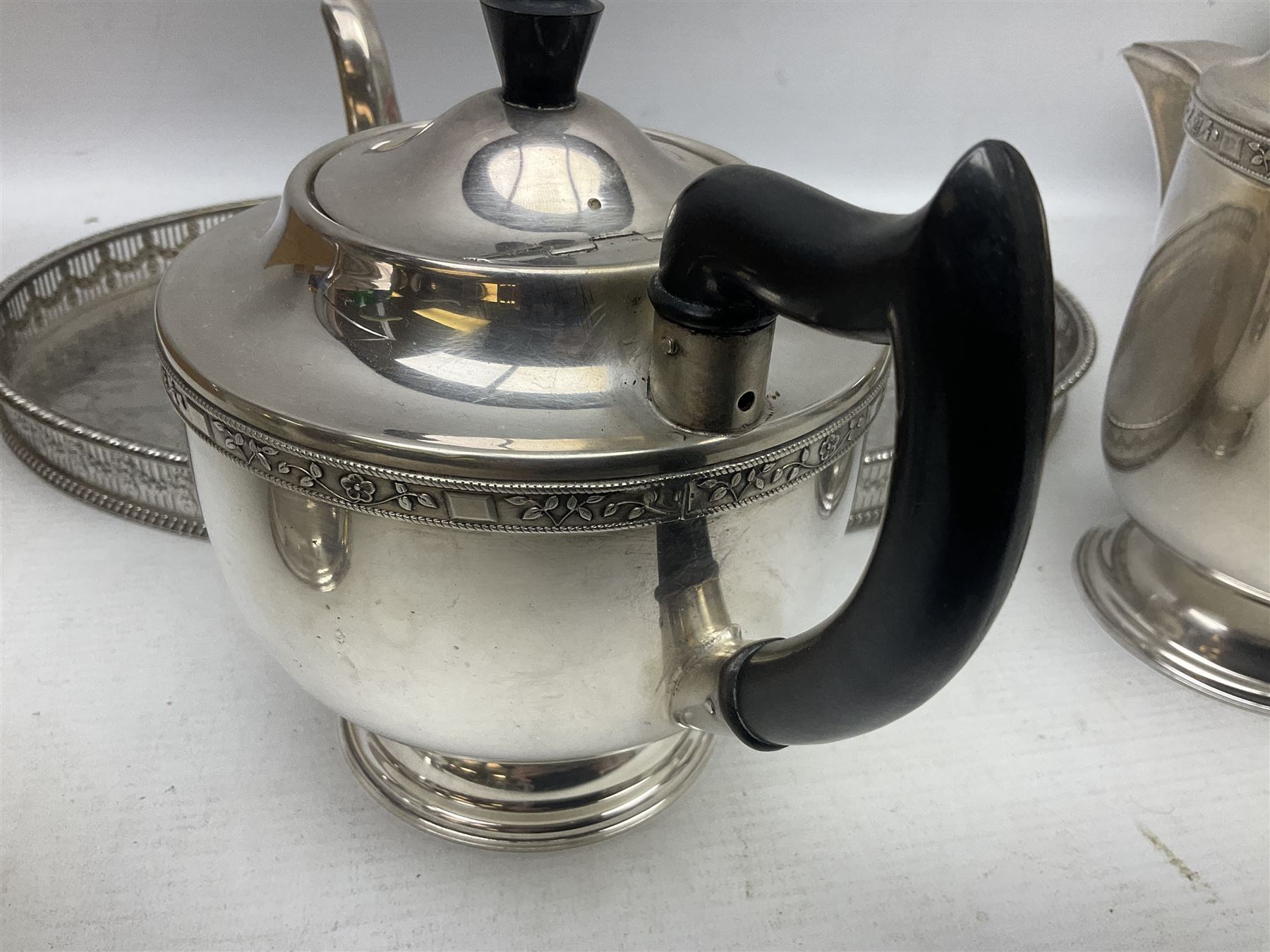 Viners of Sheffield silver-plate tea/coffee wares, the rims decorated with bands of flowers, and chased oval tray with swag decorated gallery, L39cm