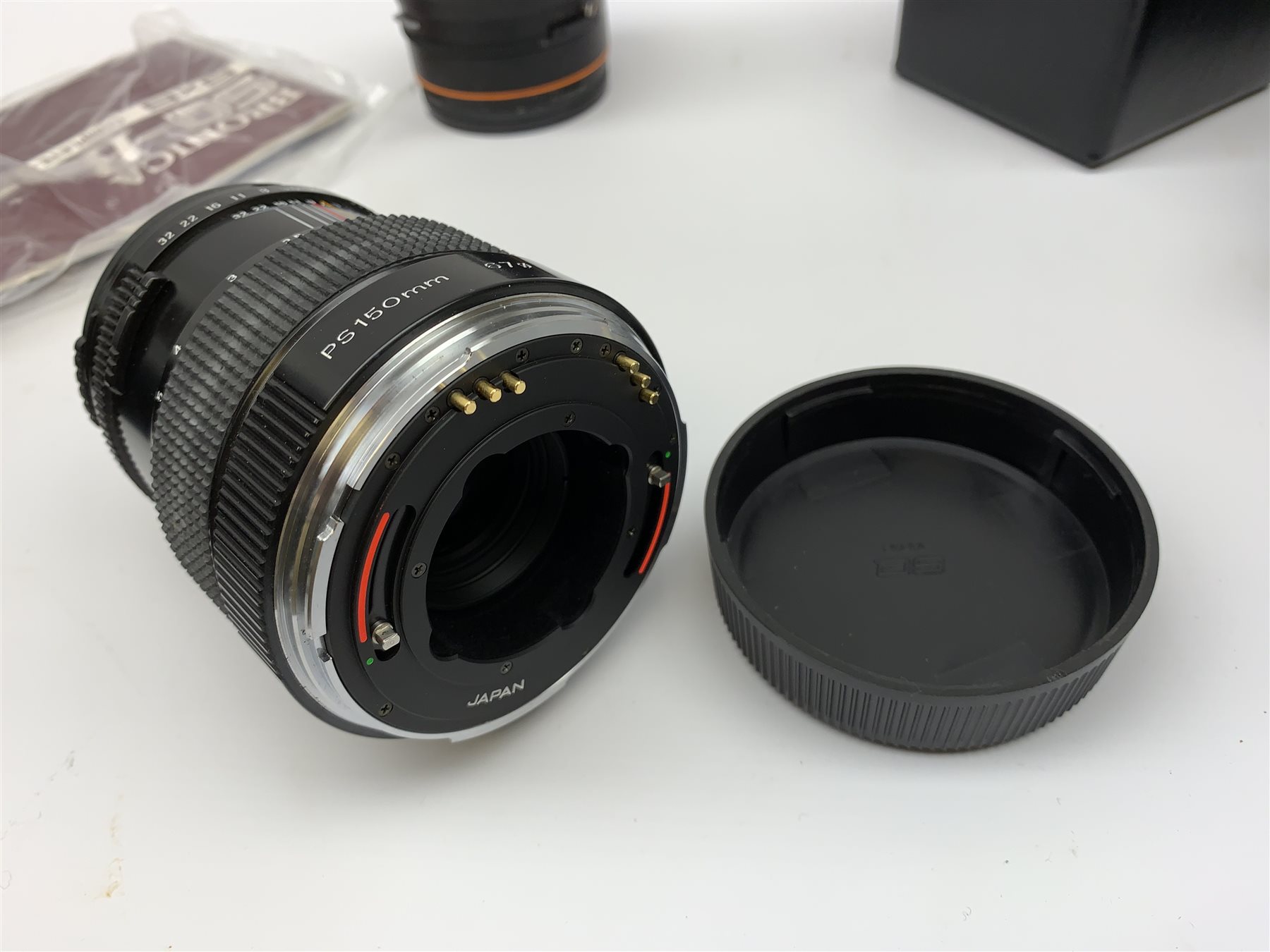 'Zenza Bronica SQ-B' camera fitted with 'Zenza Bronica Zenzanon-PS 1:28 f=80mm' lens, 'Zenza Bronica Zenzanon-PS 1:4 f=150mm' lens and 'Zenza Bronica Zenzanon-S 1:35 f=50mm' lens, with an instruction booklet