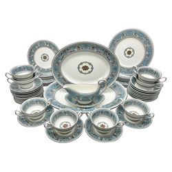 20th century Wedgwood dinner service for eight place settings, decorated in the Turquoise Florentine pattern, comprising dinner plates, salad plates, dessert plates, twin handled soup bowls and saucers, bowls, sauce boat and stand, teapot and two oval platters, with black printed marks beneath