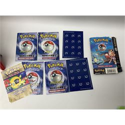 Collection of Pokemon trading cards, mostly 1999 Wizards Pokemon cards to include holo Charizard 4/102, first edition holo Machamp 8/102, further holographic cards; Dark Flareon 35/82 and Dark Vaporeon 45/82, cards from themed sets and 4th edition prints; 1998 Electronic Pokédex with cardboard boxes for themed decks Blackout, Overgrowth and Power Reserve Jungle, along with a large quantity of energy and trainer cards 