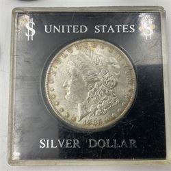 Two United States of America silver Morgan dollars dated 1885 O, 1888 O, King George V 1935 crown coin, and Mexico 1968 twenty-five pesos coin