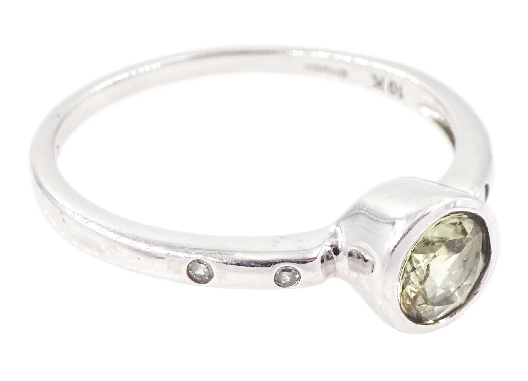 9ct white gold csarite and diamond ring, single round cut csarite with two rubover set diamonds set either side, Birmingham 2016