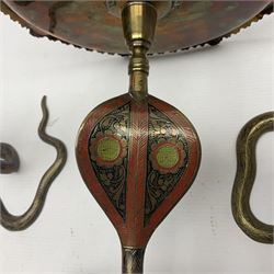 Indian brass pedestal dish, the dish engraved with peacock to centre, the stem modelled as a King Cobra, with engraved and enamelled decoration throughout, together with a similar pair of candlesticks, modelled as King Cobras, dish H23.5cm 