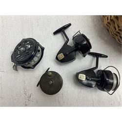 Fishing tackle and accessories housed in two wicker creels, including a landing net, fly tin, small brass reel, other reels to include two Intrepid Boy'o examples, crab lines etc 