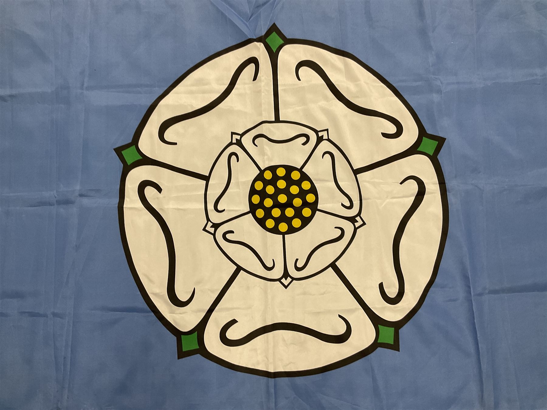 Six flags - White Ensign 180 x 86cm; two Union flags 180 x 86cm and 132 x 62cm; Falklands Islands 153 x 89cm; Yorkshire Rose 153 x 89cm; and QEII 1953 Coronation 84 x 57cm (6)