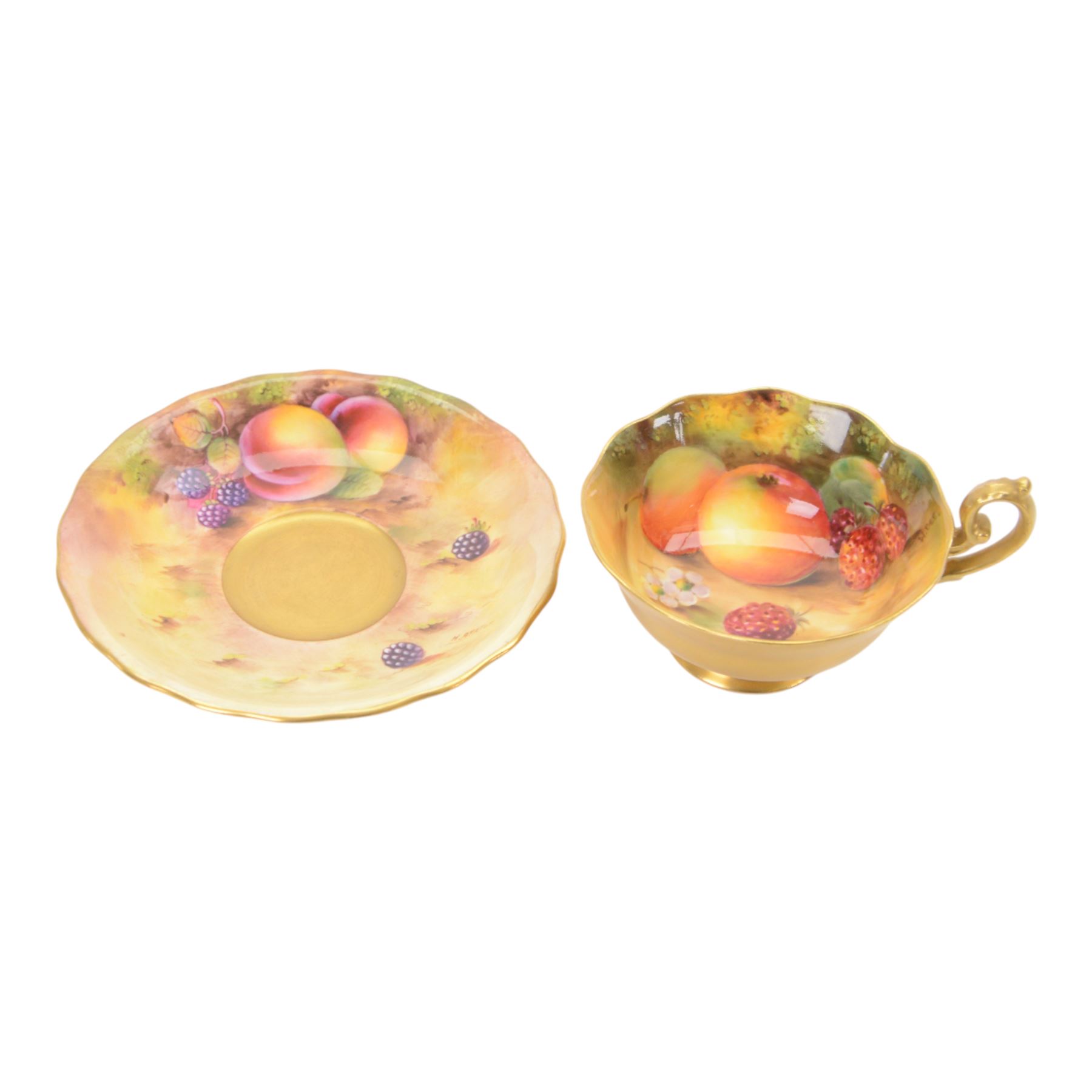 Royal Worcester fruit painted cabinet scallop edge teacup and saucer,  interior hand painted with apples and berries upon a mossy ground, the cup exterior and centre of saucer gilded, cup signed W. Bee and saucer signed H. Ayrton, each with puce coloured printed marks beneath, H8cm