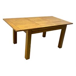 Contemporary oak dining table, rectangular panelled top with integral extension leaf, raised on square supports; set of four oak ladder-back chairs with padded brown seats