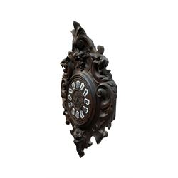 French- late 19th century carved oak wall clock c 1880, outer case with interlaced scroll carving and a carved images of fruit and wild beasts, integrated dial with porcelain cartouche Roman numerals and gothic hands, with a twin train spring driven rack striking movement striking the hours on a coiled gong.
