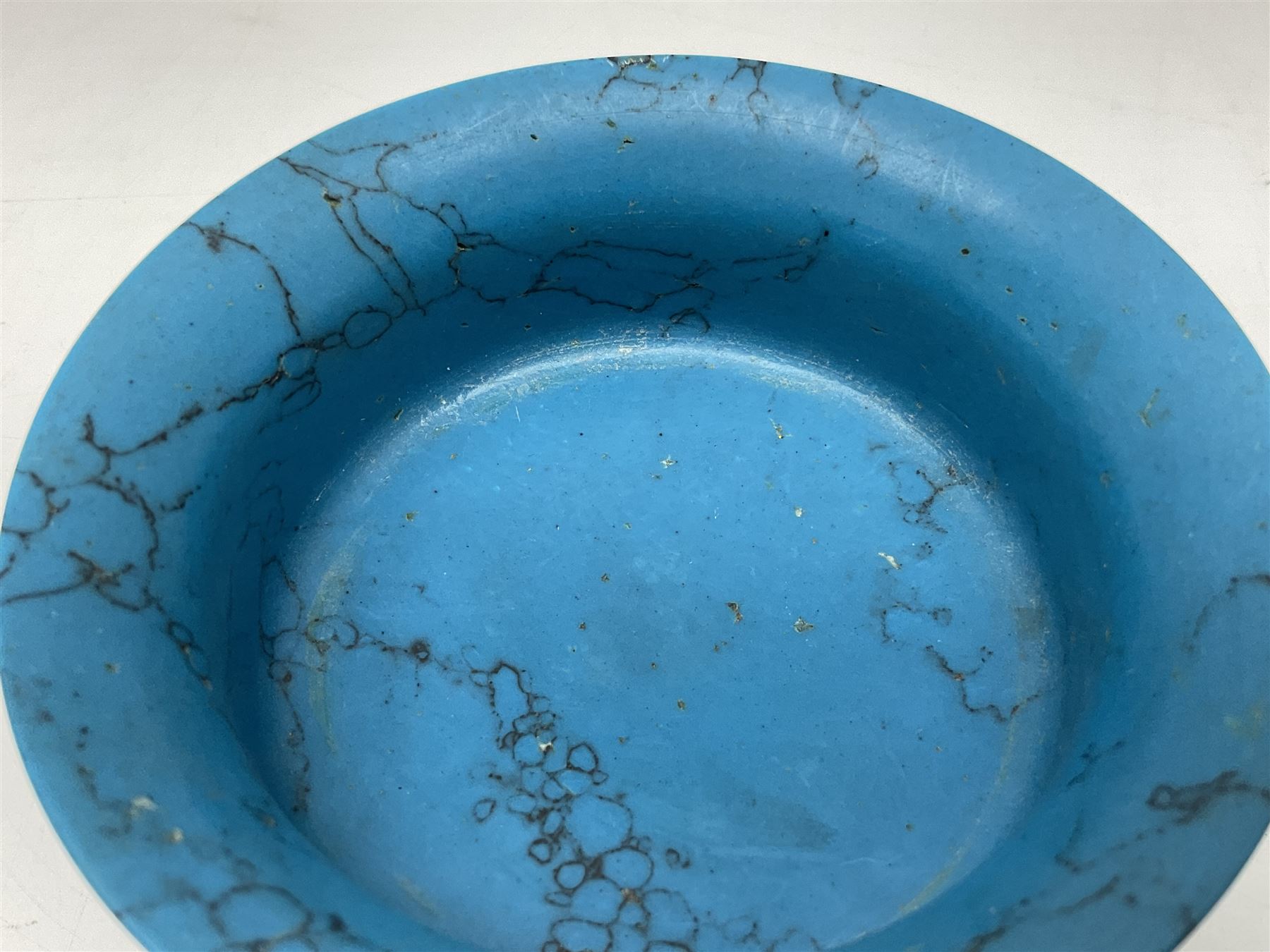 Carved single piece turquoise bowl with fluted rim, upon a raised footed base, D10cm, H5cm