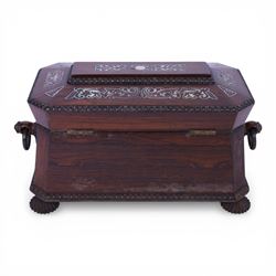 Tea caddy of sarcophagus form, inlaid with mother of pearl decoration,  the hinged lid opening to reveal two covered compartments, H24cm 