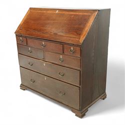 George III oak bureau, the fall front enclosing a fitted interior of small drawers and pigeonholes, above seven graduated drawers with brass plate handles and bone escutcheons, raised on bracket feet