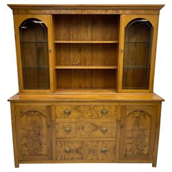 David Shackleton of Snainton - highly figured elm dresser, projecting moulded cornice over raised display cabinets and shelves, the base fitted with three central drawers and flanked by panelled cupboards, inscribed 'DS 1990'