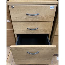 Three light oak three drawer filing pedestals - THIS LOT IS TO BE COLLECTED BY APPOINTMENT FROM DUGGLEBY STORAGE, GREAT HILL, EASTFIELD, SCARBOROUGH, YO11 3TX