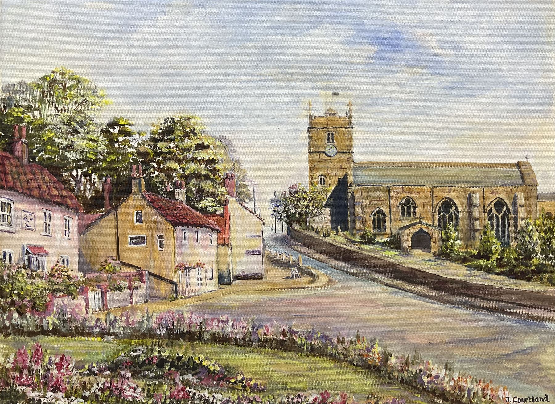 J Courtland (British 20th century): 'Hunmanby Village' near Filey, oil on canvas board signed, titled verso 30cm x 40cm