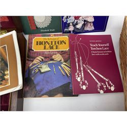Collection of lace making wooden bobbins, together with lace making books and a handmade storage box