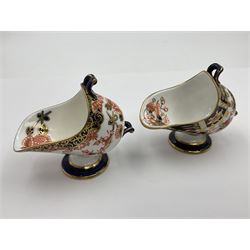 Group of Crown Derby and Royal Crown Derby Imari pattern miniatures, including mid 19th century Stevenson and Hancock cauldron, with painted mark beneath, H5.5cm, a near pair of early Royal Crown Derby scuttles, decorated in the 6299 pattern, each with printed and painted marks beneath including illustration date codes for 1913 and 1922, tallest 6.5cm, and a further early 20th century Royal Crown Derby scuttle, decorated in the 6299 pattern, with printed and painted marks beneath including illustration date code for 1922, H5.5cm, (4)
