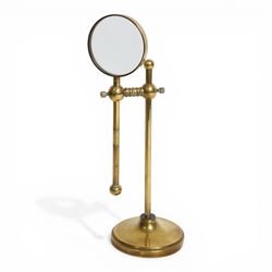 Early 20th century lacquered brass table top adjustable magnifying glass, with pivoting le...