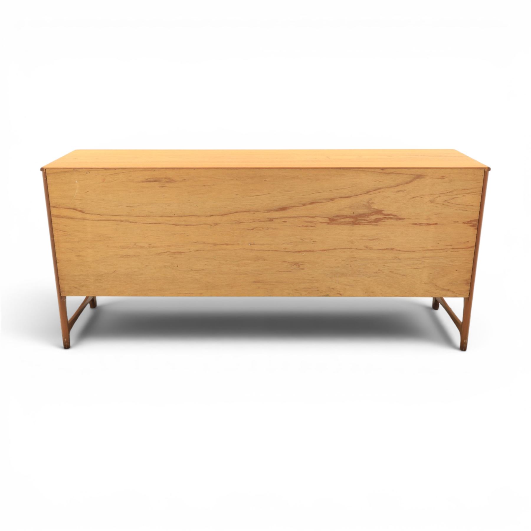 Nathan - 'Squares' mid 20th century teak sideboard, fitted with three drawers with brass ring handles, above a central fall front cabinet, flanked by two cupboard doors, raised on square tapering supports